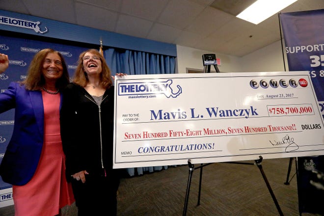 Mavis L. Wanczyk, right, poses with Massachusetts state treasurer Deborah Goldberg on Aug. 24, 2017, after coming forward only hours after winning the $758 million multi-state Powerball lottery jackpot.