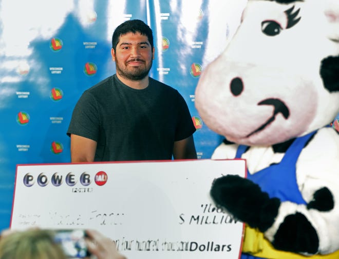 Manuel Franco, who purchased the $768.4 million Powerball ticket sold last month in New Berlin, appears at a news conference Tuesday, April 23, 2019 at the Wisconsin Lottery's offices in Madison, Wis. It was the largest jackpot in the Wisconsin lottery's history and the third-largest lottery prize in U.S. history. The lump sum payout is $477 million.